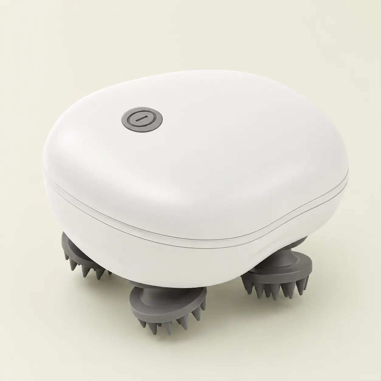 Masseur électrique 2-en-1 blanc avec quatre têtes de massage en silicone, vue de trois quarts